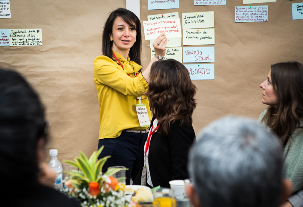 Woman in front of board